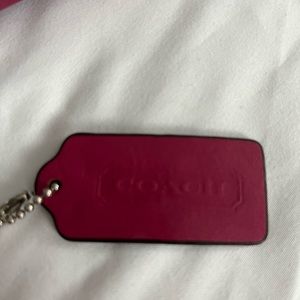 Fuchsia and brown authentic COACH that’s a body bag right it’s a cross body